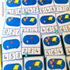 Montessori continent counting cards with color-coded maps and numbers for preschool geography and counting activities.
